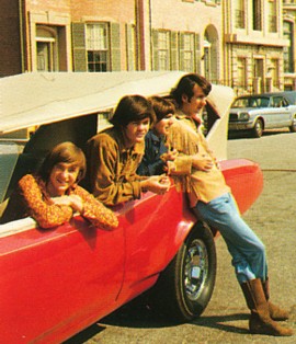 All four with the MonkeeMobile in the 60s