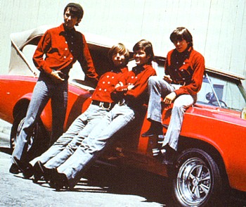 All four with the MonkeeMobile in the 60s